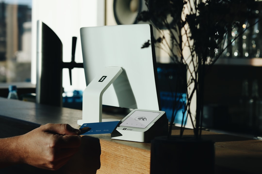 A person is cutting a piece of paper with a knife