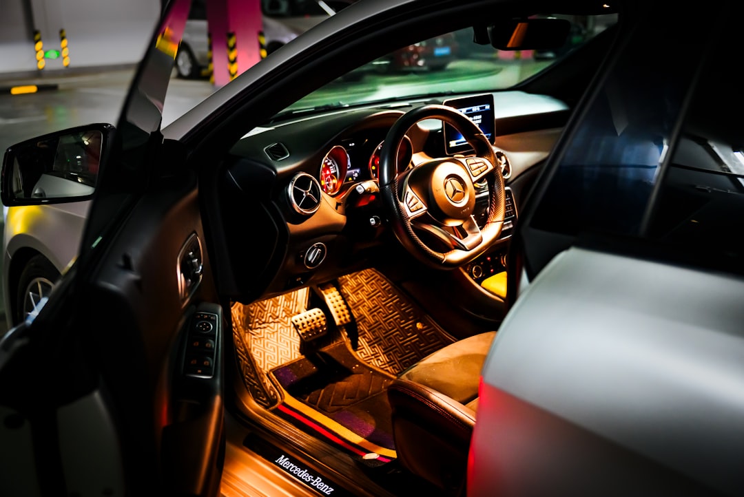 Interior of a luxury car with illuminated dashboard.